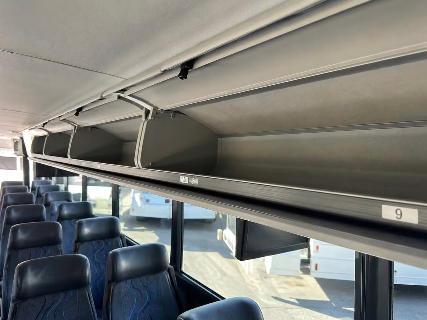 mcdonough 56 passenger charter bus overhead storage